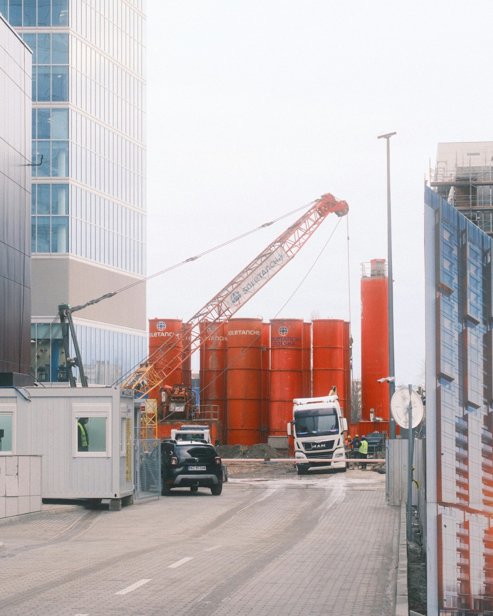 A crane is on the side of a road