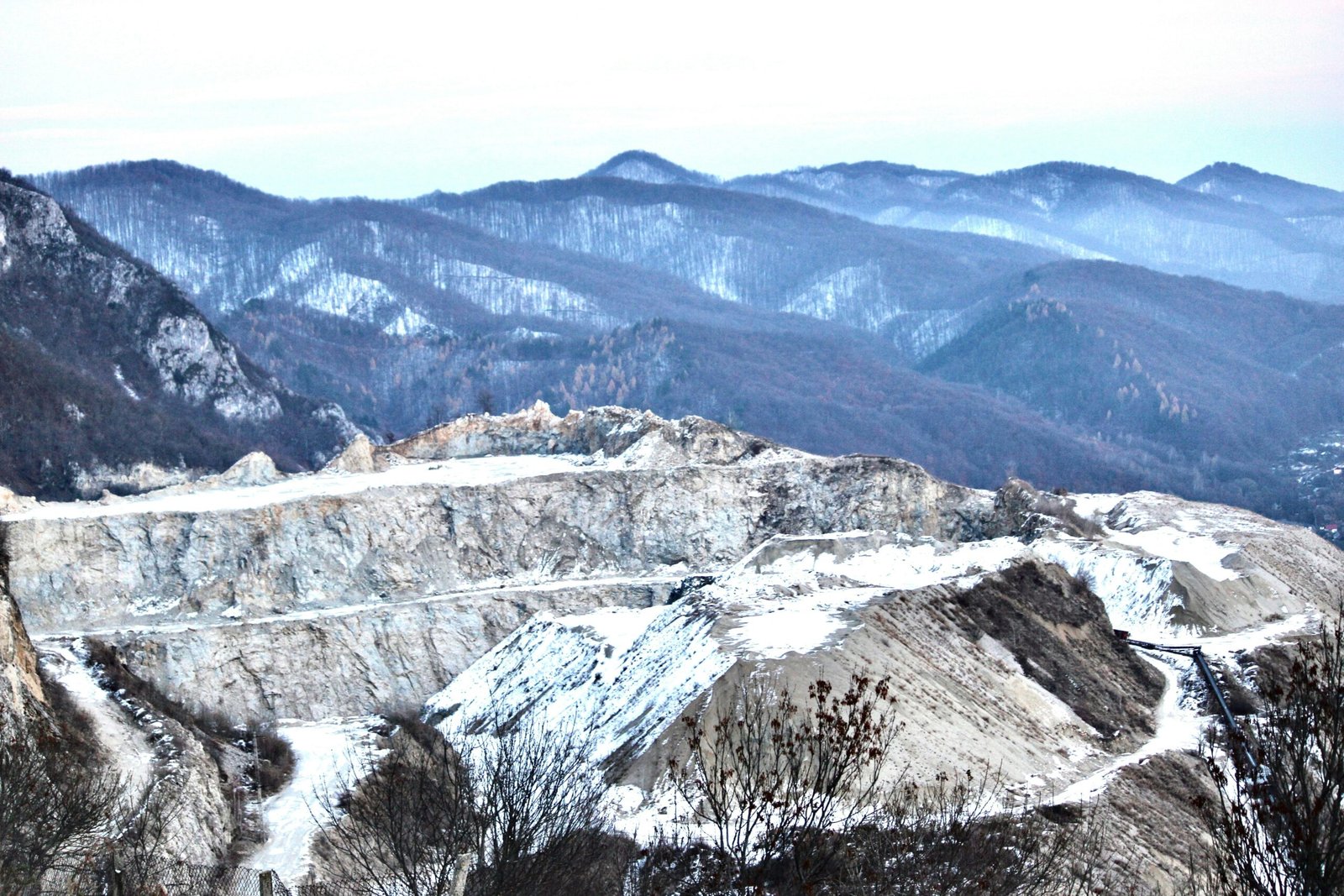 A view of a mountain range with mountains in the background